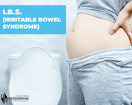 Close-up of a bloated abdomen with loose trousers near a toilet, showing IBS discomfort