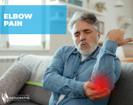 Man holding his elbow in pain with red highlight, indicating joint inflammation or strain