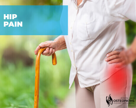 Older woman with hand on her hip and a walking stick, red glow highlighting hip pain