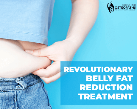 Close-up of person pinching belly fat above jeans, promoting abdominal fat reduction treatment